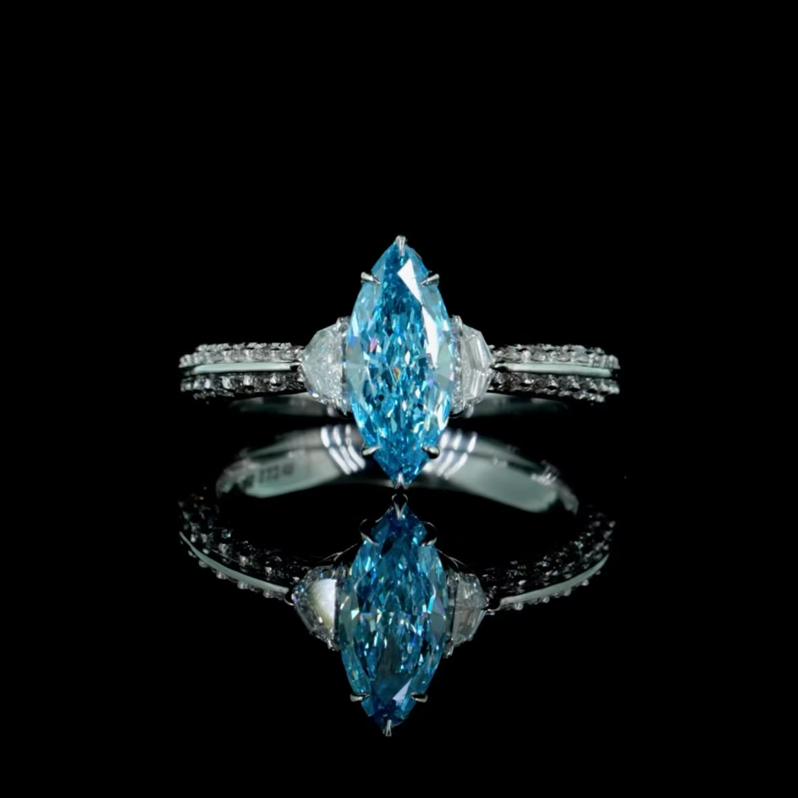1.12 ct. Blue Diamond Side-Stone Ring